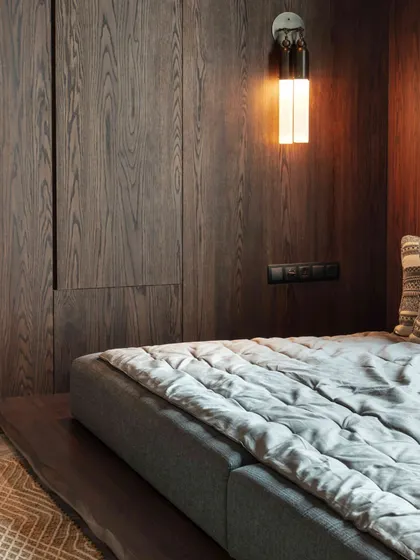 A detail of the 'gadda-bed' in the lounge, showing the custom millwork and a cozy, low-level sleeping arrangement perfect for a child's room.