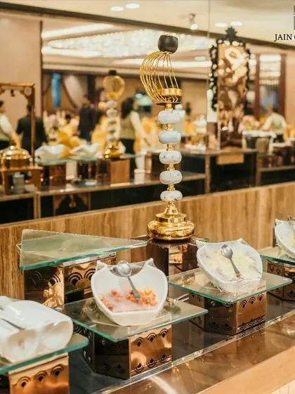 Crafted with elegance, served with perfection. Our dessert bar features a variety of treats in stylish bowls and stands, creating a feast for the eyes.