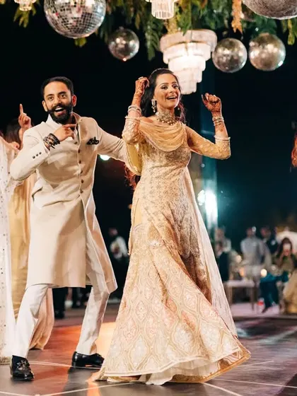 The couple joining their friends on the dance floor. The best parties are when everyone dances together.