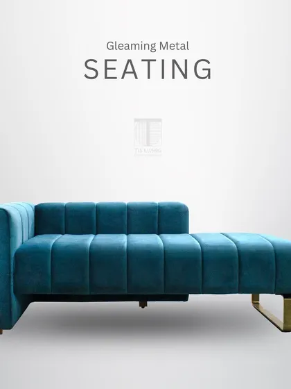 This gleaming metal seating, a teal channel-tufted chaise, rests on a sleek brass-finished frame. It's a piece of modern luxury that adds a bold pop of color and style.