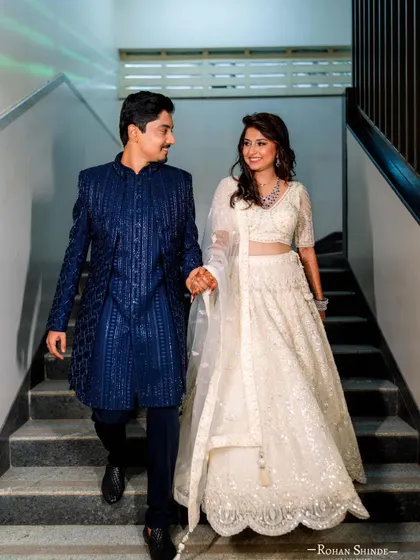 A candid moment of the couple making their entrance. This is what I mean by creating picture-perfect memories in rented outfits.