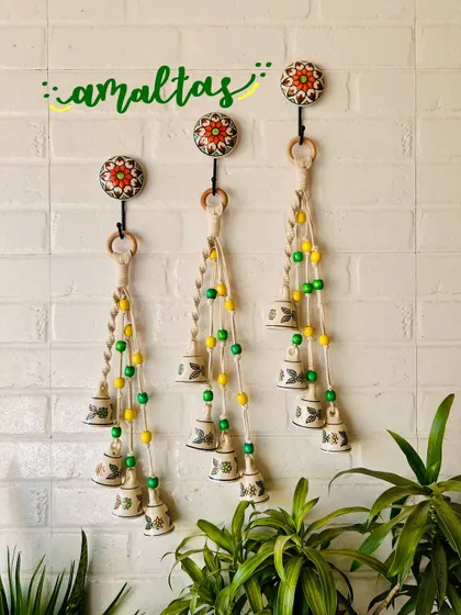 A beautiful display of our 'Symphony Chimes' in the 'Amaltas' color combination. The yellow and green beads paired with hand-painted ceramic bells create a fresh and natural look.