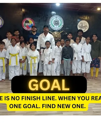 A group photo with a clear message: there is no finish line. In martial arts and in life, when you reach one goal, you find a new one.
