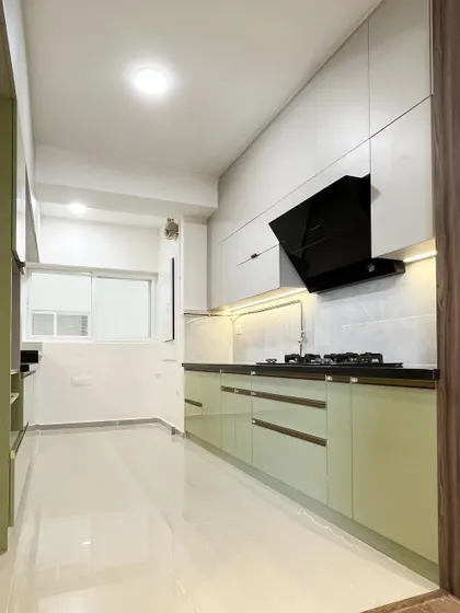 A full view of the pista green parallel kitchen, showing its bright and airy feel. The design is both stylish and highly functional.