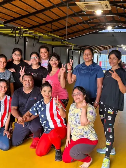 The heart and soul of my classes. Each photo captures a unique moment with my incredible community after a sweaty, joyful session. This is our shared victory lap.