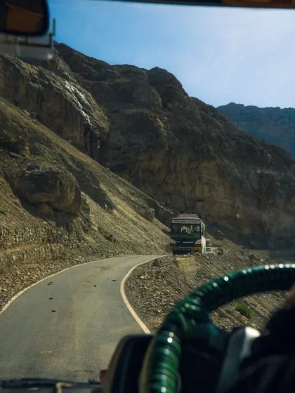 A view from the driver's seat on the winding, dangerous roads of Spiti. This perspective gives a thrilling, first-person feel to the travel documentary.