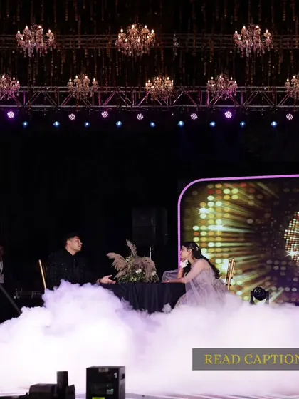 It's all in the details. We create entire narratives for your sangeet, like this romantic date scene complete with a table set amidst clouds of smoke, perfectly capturing the "kuch kuch hota hai" feeling.