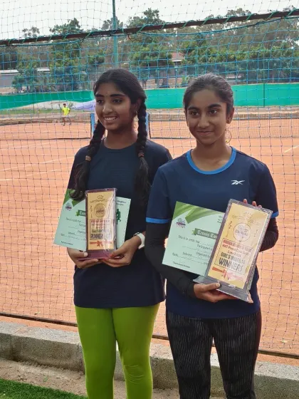 Kanisha and Hamsini, the winner and runner-up of the Girls Under 14 tournament, with their awards. These head to head matches help build resilience and skill.