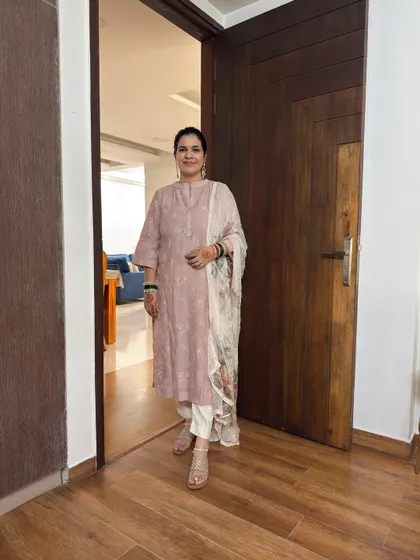 Here's how I completed my Teej look by adding a light, printed dupatta. It's a great example of how you can mix and match pieces from your wardrobe to create a fresh look for any festival.