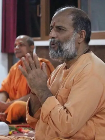 Leading a chanting session, or kirtan. The repetition of mantras is a powerful Bhakti Yoga practice that quiets the mind and opens the heart.