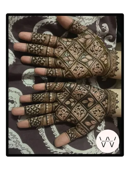 A full grid-pattern design on the back of the hands for a wedding guest.