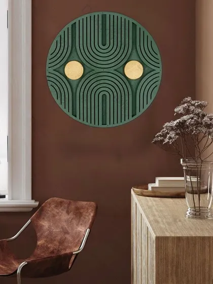 Shown against a warm, earthy wall, the green and gold sunburst art creates a rich and inviting atmosphere.