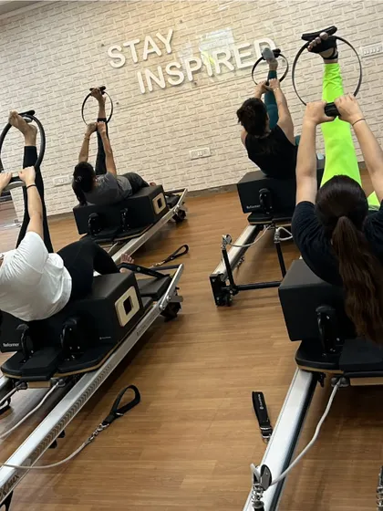 Various shots of members and instructors in action during our dynamic Reformer Pilates classes.