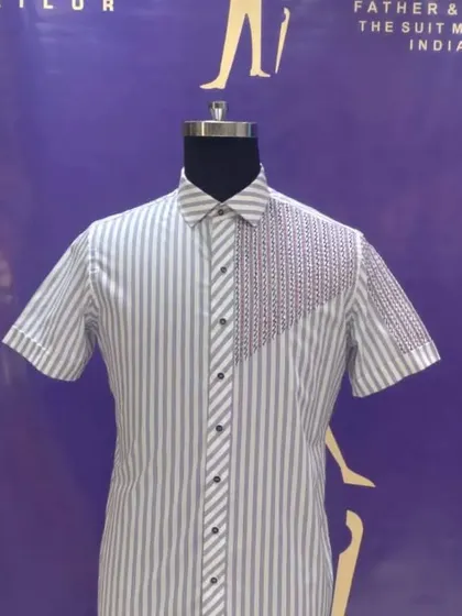 A custom striped half-sleeve shirt with an embroidered panel. This is a great example of how we can mix patterns and textures to create a unique design.