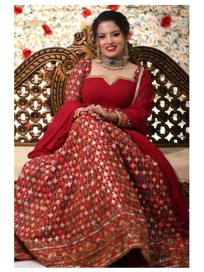 Make a grand entrance with this heavily embroidered red bridal lehenga. It is designed to be a showstopper, perfect for making your wedding day or reception unforgettable.