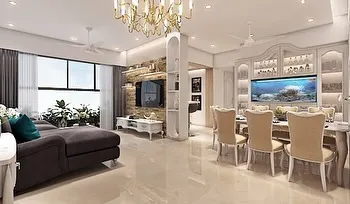 An integrated living and dining space where modern comfort meets vintage elegance. The design features a stone-clad TV wall, a plush sectional sofa, and a classic white dining set with a built-in aquarium.