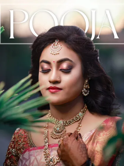 A stunning close-up portrait of the bride, her eyes closed, framed by natural greenery.