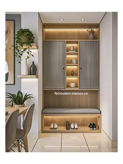 An advanced storage solution for your entryway. This unit features a comfortable seating bench with shoe storage below and sleek, handleless cabinets above for a minimalist look.