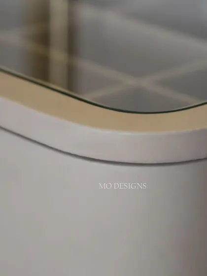 A close-up of the Solitaire bedside table's construction, highlighting the smoothly curved edges and the quality of the finish. This piece adds a touch of modern elegance and smart storage to your bedroom.