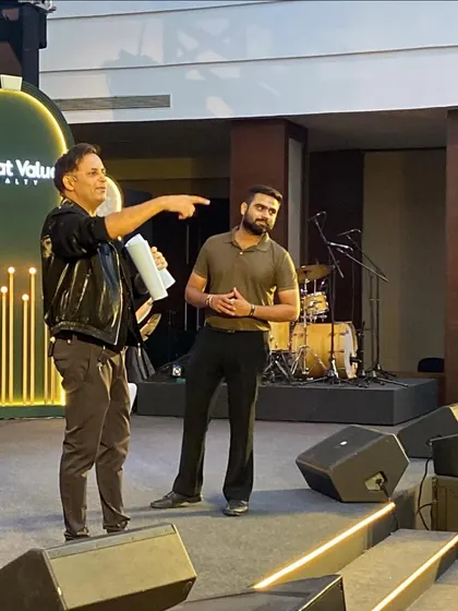 Here I am interacting with an audience volunteer on stage. Getting people involved is the key to making the magic feel real and creating a fun, engaging atmosphere.