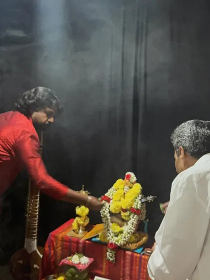Performing rituals during the Saraswati Pooja. Tradition and spirituality are deeply connected to the learning of Indian classical music.