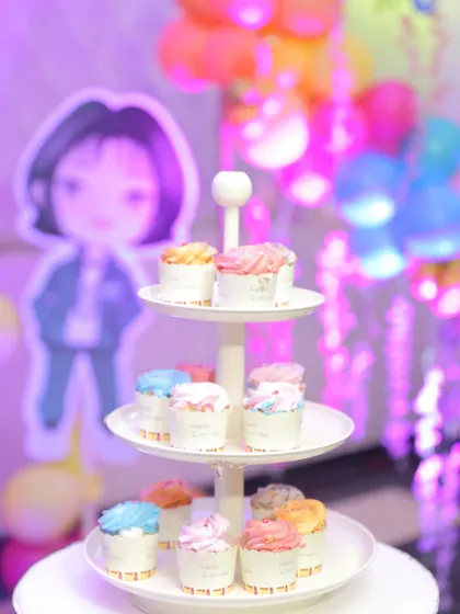 A themed cupcake tower from the 'Squid Fiesta' party. Small details like themed desserts add to the overall experience and delight the guests, especially the little ones.