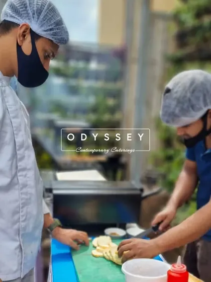 Our chefs meticulously preparing food outdoors. This behind-the-scenes shot shows the care and precision that goes into every dish we create.