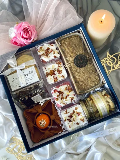 My luxury hamper box for Diwali, unpacked. It includes a coffee walnut tea cake, rose milk tres leches shots, nutty truffles, and more, all beautifully arranged.
