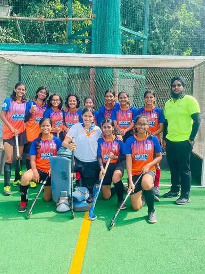 Another shot of our victorious women's team with their coach after the win against India Rush, showcasing their unity and team spirit.