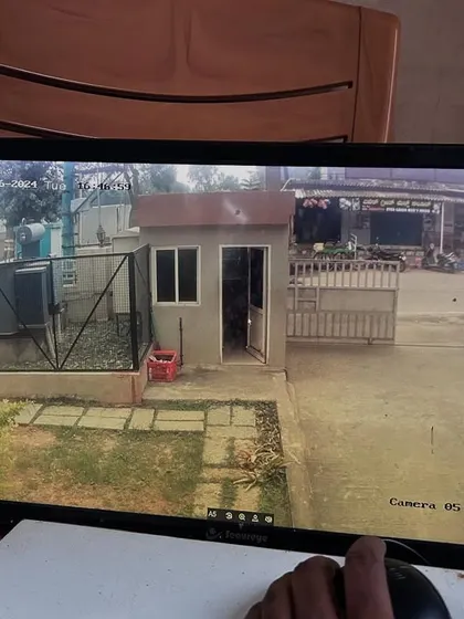 Monitoring the security cabin and main gate of a residential complex.
