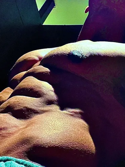 Another angle of my abs, showing the deep cuts and separation that only come from intense dedication.