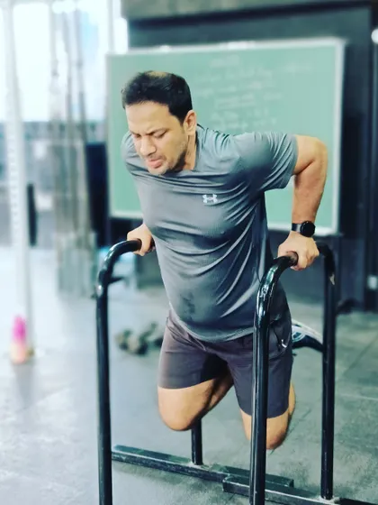 The face of pure effort. This member pushes through a set of dips, building serious upper body pressing strength.