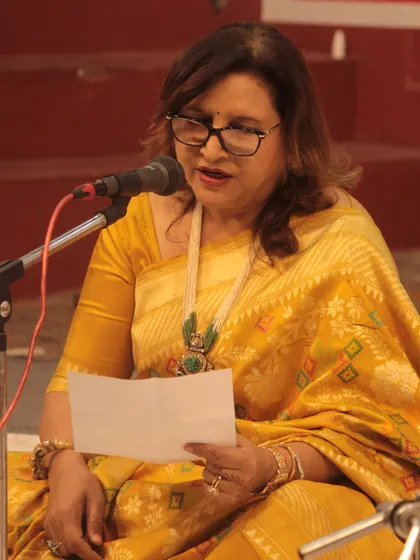 An artist reading lyrics before her performance, ensuring a heartfelt and accurate rendition.