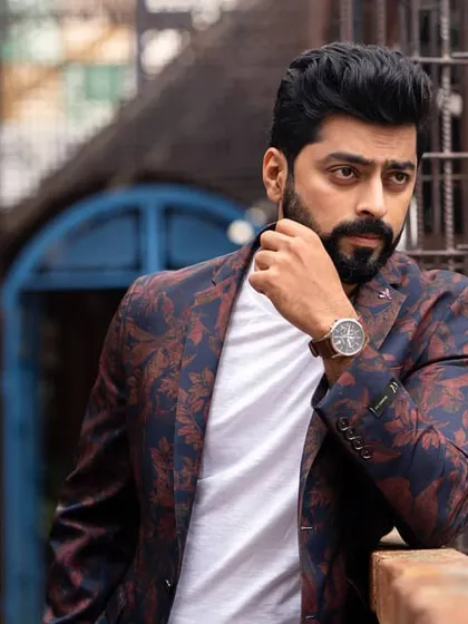 Another angle from Tarak Ponnappa's urban shoot, focusing on his confident pose and the texture of the location. We work to get a variety of shots to build a comprehensive portfolio.