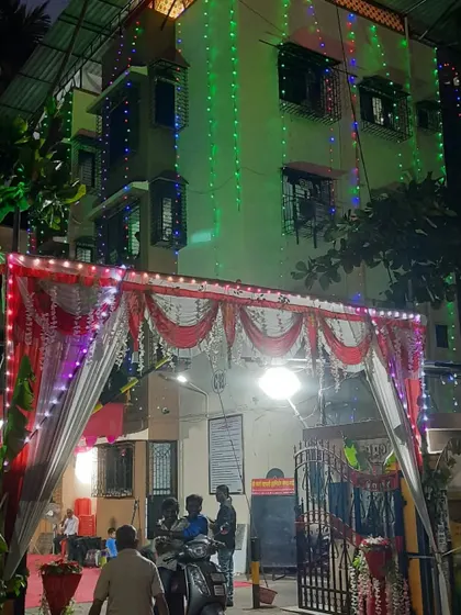 Another view of the building entrance, showing how the decorative gate and the lights on the building come together.