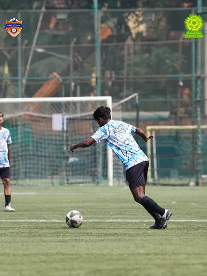 Driving towards the goal. A forward makes a run into the opponent's territory. This aggressive, forward-thinking play is a hallmark of our team's style.