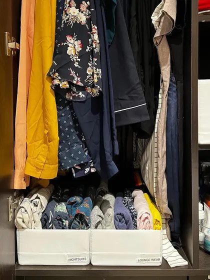 Labeled bins for "Nightsuits" and "Lounge Wear" create a clear, easy-to-maintain system right under the hanging clothes.