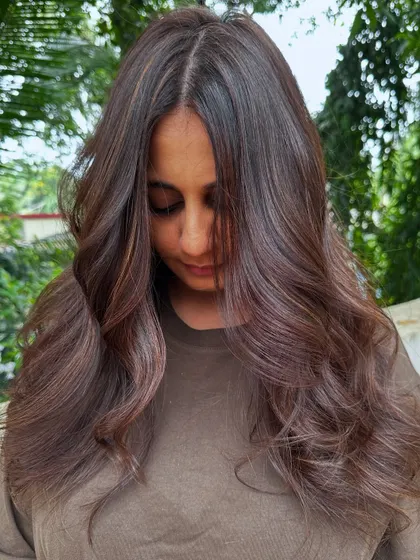 A portrait of the client with her new 'Chestnut Brown' hair.