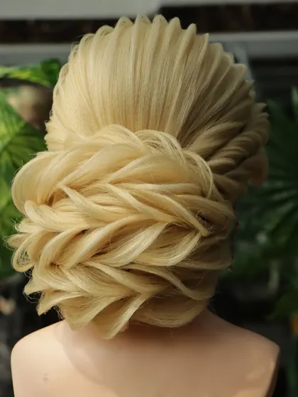 The back view of this reception bun shows the incredible detail and craftsmanship involved. These are the advanced skills that will set you apart as a hairstylist.