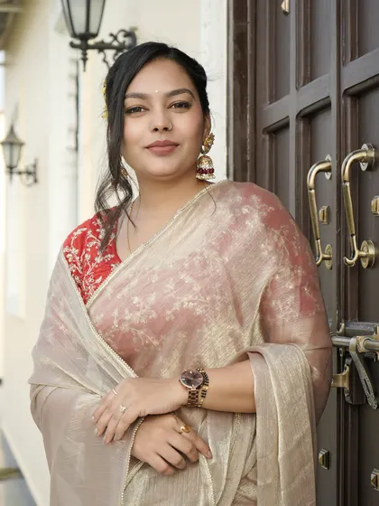 A full-length shot showing how the jhumkas balance the entire traditional ensemble.