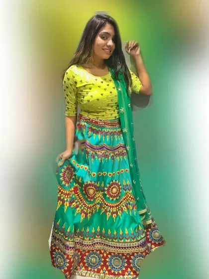 A bright and colorful printed lehenga perfect for a mehendi function or Navratri celebrations. The vibrant turquoise and lime green combination is fun and eye-catching.
