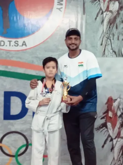 This young champion from my DTSA team proudly displays his silver medal and trophy. Every win is a team win.
