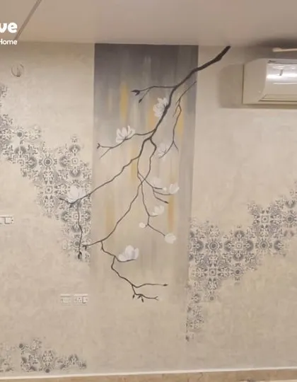 A beautiful example of a customized wall texture combining a floral branch motif with a background pattern. This layered approach creates a truly unique piece of wall art that is both elegant and artistic.