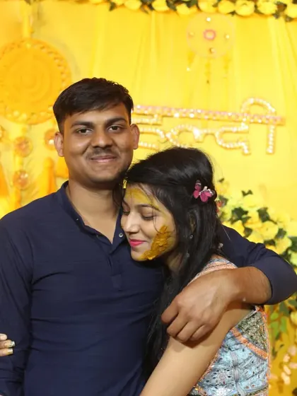 An intimate and candid photograph of a couple sharing a hug during the Haldi festivities. Capturing these quiet, emotional moments is a big part of my event photography style.