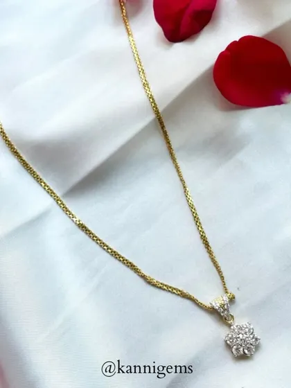 Every piece of jewellery tells a story. This delicate gold chain with a floral diamond pendant speaks of classic beauty and enduring charm, perfect for adding a touch of sparkle to life’s precious moments.