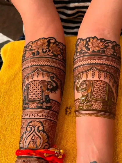 A full view of the elephant armband design, showing the completed work on both arms.