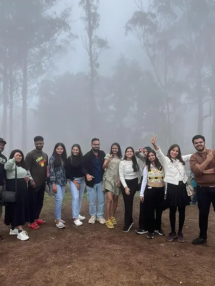 The fog adds a magical atmosphere to our group photos in the Kodaikanal forest.