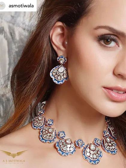 A close-up from the A S Motiwala campaign, highlighting the intricate enamel work and stunning diamonds of this peacock-inspired masterpiece.