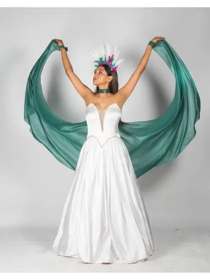 A powerful, symmetrical pose where the model uses the fabric to create wing-like shapes, resulting in a dramatic and memorable fashion statement.