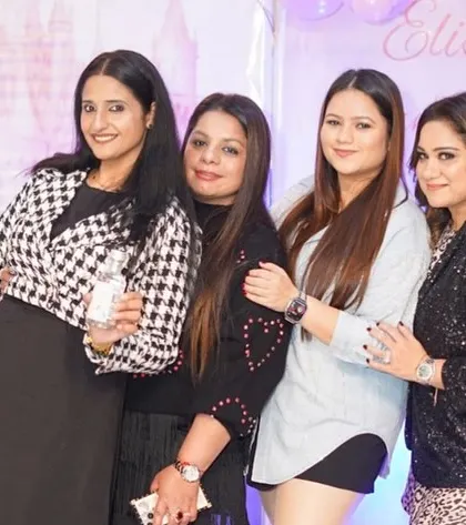 A group of friends huddle together for a photo, capturing the fun of the day.